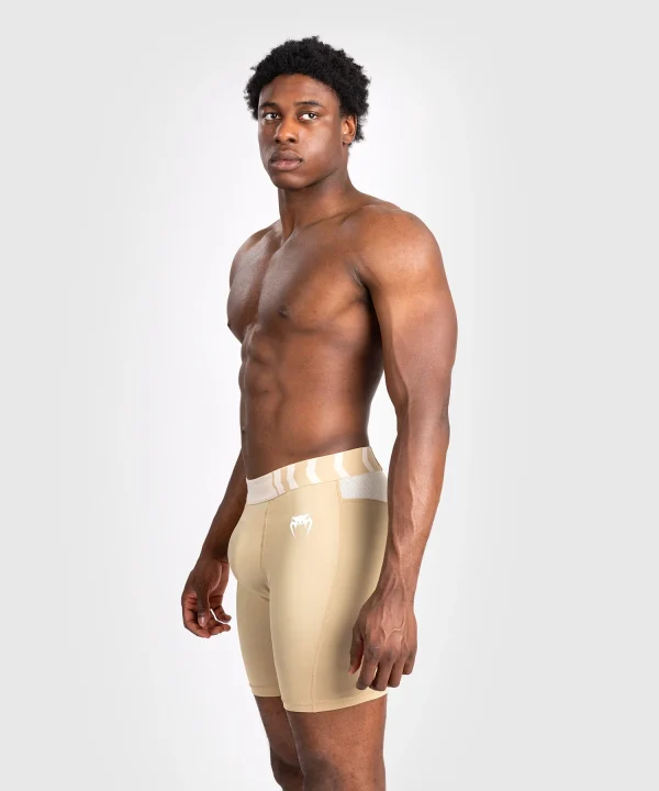 Venum Tempest Mens Vale Tudo Shorts Beige Sand 2 Man wearing Venum Tempest Vale Tudo shorts