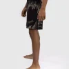 Venum Tiger Kids Fight Shorts Black Orange 1 Young boy wearing Venum Tiger Kids Fight Shorts
