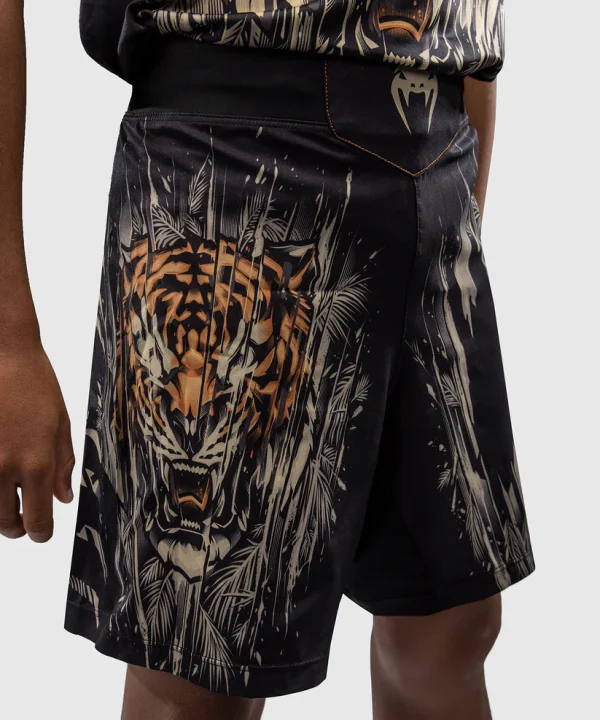 Venum Tiger Kids Fight Shorts Black Orange 3 Child wearing Venum Tiger Kids Fight Shorts