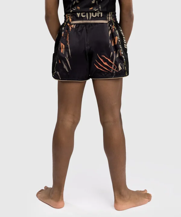 Venum Tiger Kids Muay Thai Shorts Black Orange 3 Kid wearing Venum Tiger Kids Muay Thai Shorts
