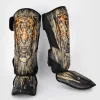 Venum Tiger Shin Guards on a white background