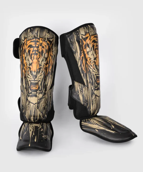 Venum Tiger Shin Guards on a white background