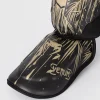 Venum Tiger Shin Guards on a white background