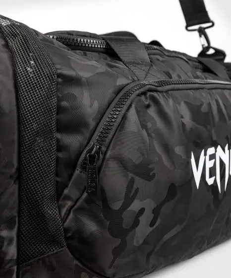 Venum Trainer Lite Sports Duffel Bag Black Camo 6 Venum Trainer Lite Sports Duffel Bag in a studio setting