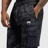 Venum Trooper Mens Tracksuit Bottoms Pants Black Charcoal 4 Man wearing Venum Trooper Men's Tracksuit Bottoms Pants