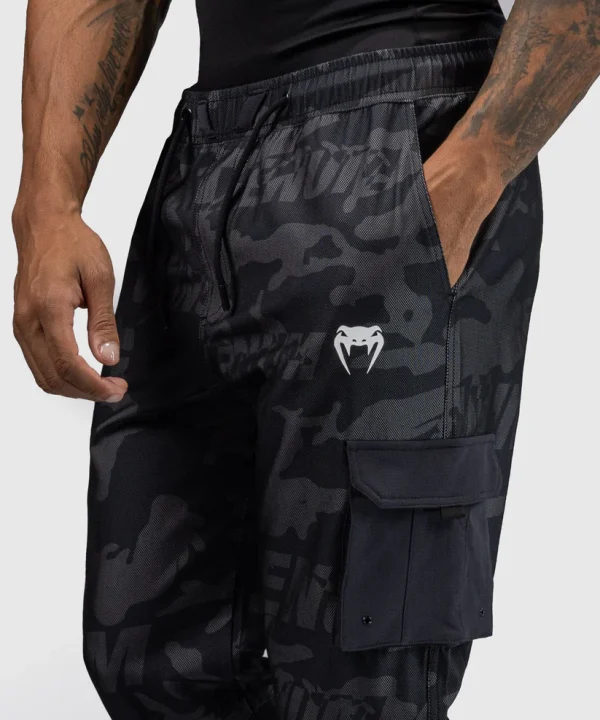 Venum Trooper Mens Tracksuit Bottoms Pants Black Charcoal 4 Man wearing Venum Trooper Men's Tracksuit Bottoms Pants
