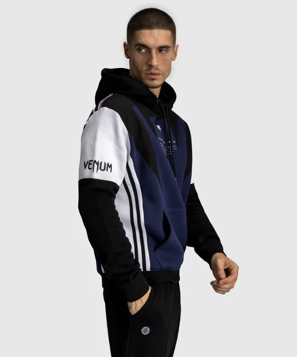 Venum X Tekken 8 Jin Kazama Hoodie Blue Black White 1 Venum x Tekken 8 Jin Kazama Hoodie displayed on a mannequin