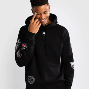 Venum x Tekken 8 Paul Phoenix Hoodie in a studio setting.