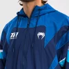 Man wearing a Venum x Top Rank Original Men's Hooded Tracksuit Jacket