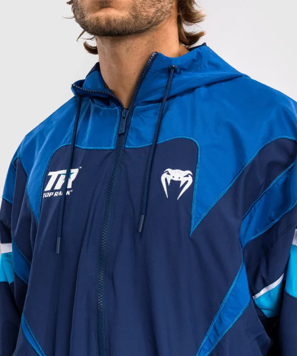 Man wearing a Venum x Top Rank Original Men's Hooded Tracksuit Jacket