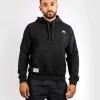 Venum X Ufc Ulti Man Hoodie Black 2 Man wearing a Venum x UFC Ulti-Man Hoodie