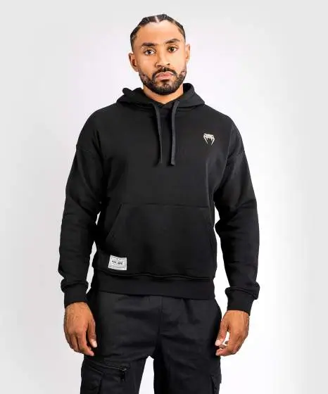 Venum X Ufc Ulti Man Hoodie Black 2 Man wearing a Venum x UFC Ulti-Man Hoodie