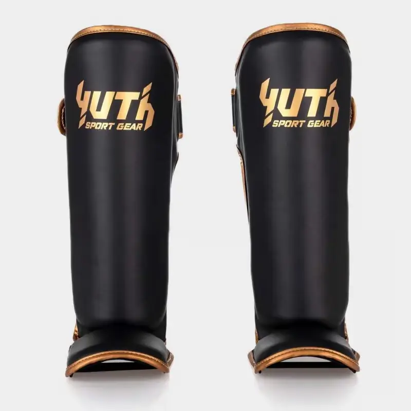 Yuth Shinguards Gold Line on white background