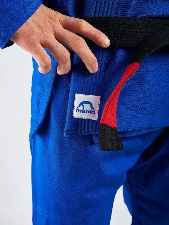 Man wearing a Manto Base 2.0 BJJ Gi in a training setting