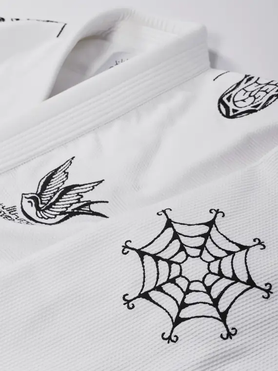 Manto Miko BJJ Gi in white color on a hanger