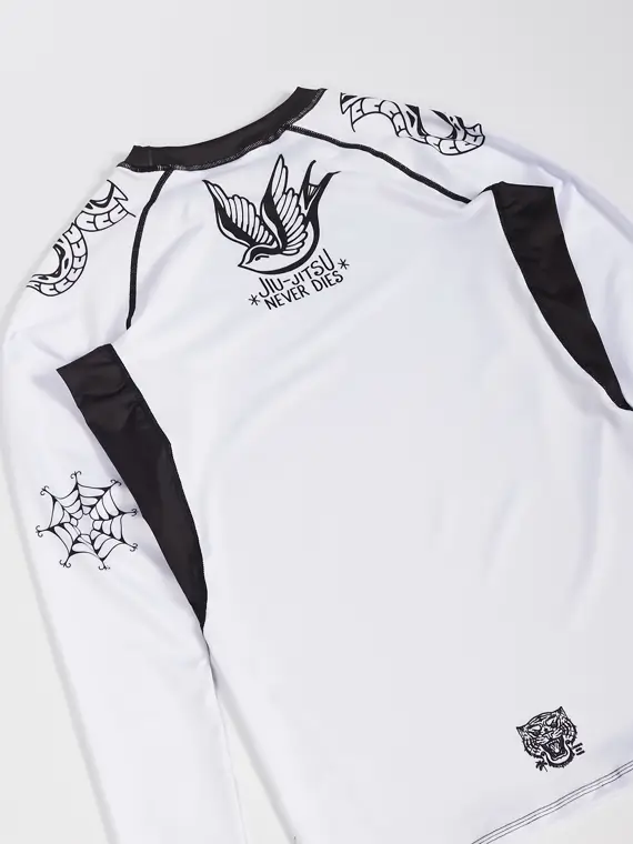 Black and blue Manto Miko Longsleeve Rash Guard on a white background.