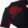Martial artist wearing Manto Less Talking More Fighting Rash Guard