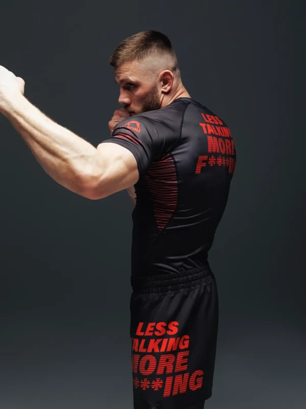 Manto Less Talking More Fighting Rash Guard on a white background