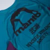 Manto Society Rash Guard on white background