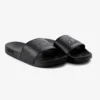 Pair of Manto Blackout Logo Slides on a neutral background