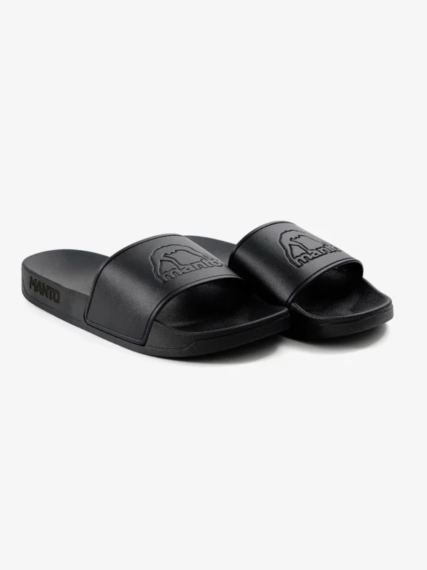 Pair of Manto Blackout Logo Slides on a neutral background