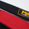 Blue Manto Original BJJ Belt neatly placed on white surface.