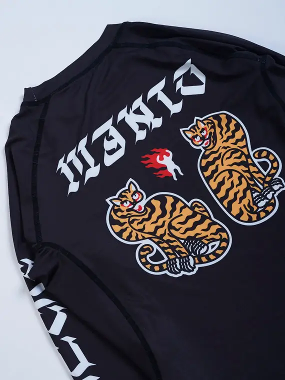 Manto Tigers Long Sleeve Rash Guard on a solid background