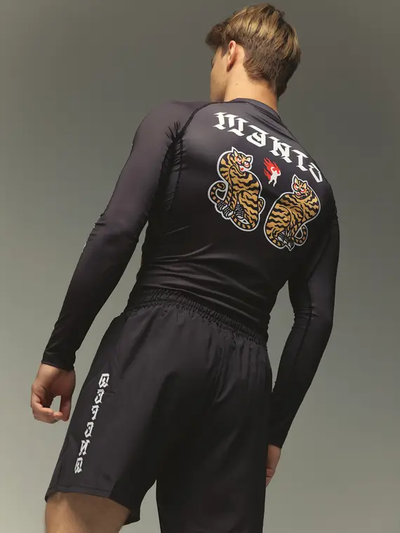Manto Tigers Long Sleeve Rash Guard on a white background