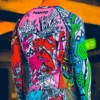 Manto Wicky Longsleeve Rash Guard Product Image Manto Wicky Longsleeve Rash Guard in action