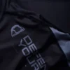 A competitive athlete wearing Manto Ranked BJJ Rash Guard