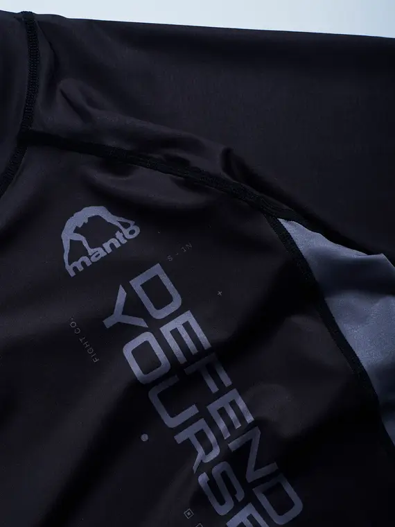 A competitive athlete wearing Manto Ranked BJJ Rash Guard