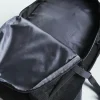 A grey and black Manto Cross Backpack