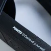 A pair of Manto Defend Slides on a plain background