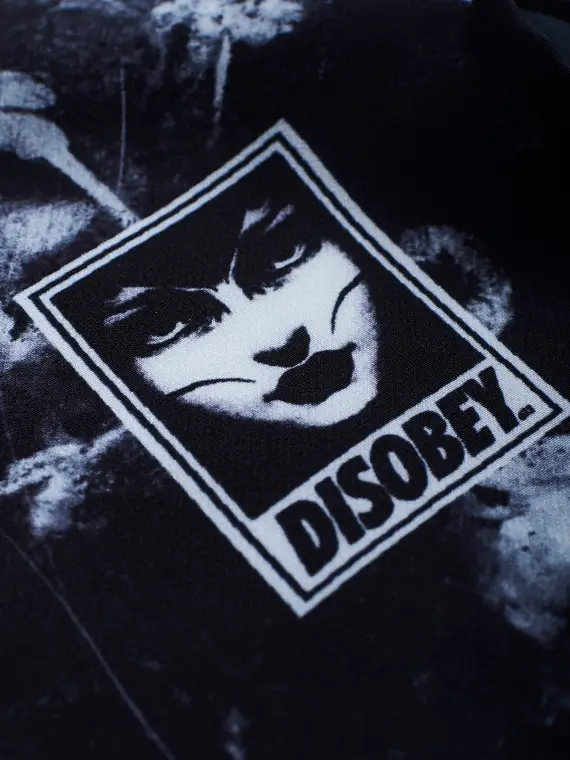 Manto Disobey Fight Shorts against a white background