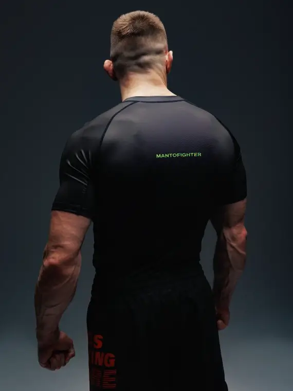 Manto Fighter Rash Guard on a plain background