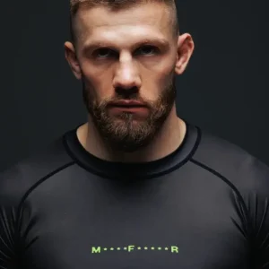 Black and red Manto Fighter Rash Guard on plain background