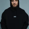 Male model wearing a Manto Label Oversize Hoodie in a urban setting