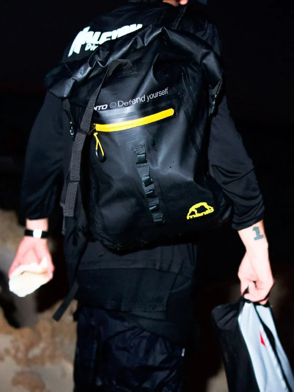 Manto New York Roll Top Backpack Black 1 Manto New York Roll Top Backpack in a neutral background