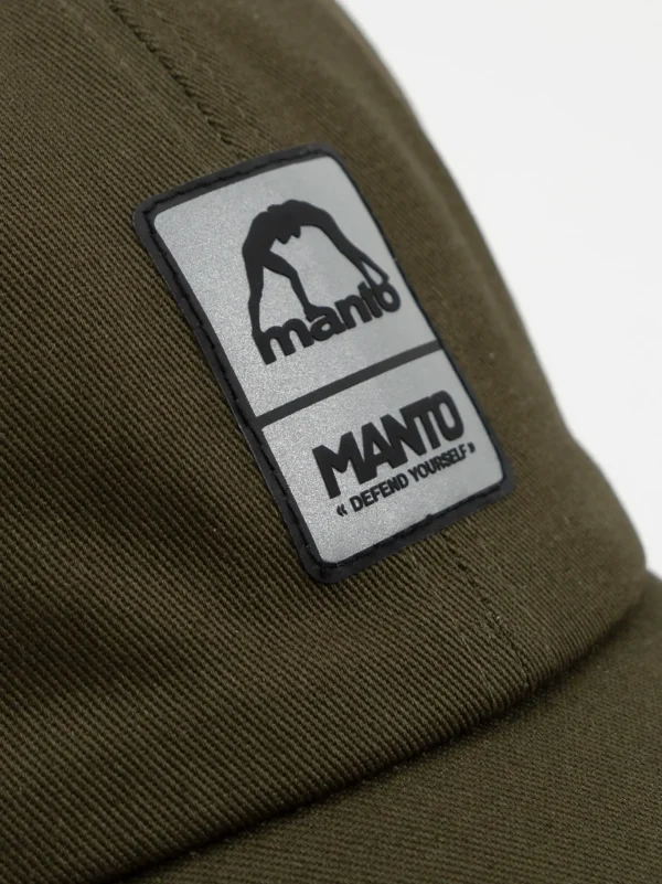 Manto Pulse Cap in black color resting on a white background