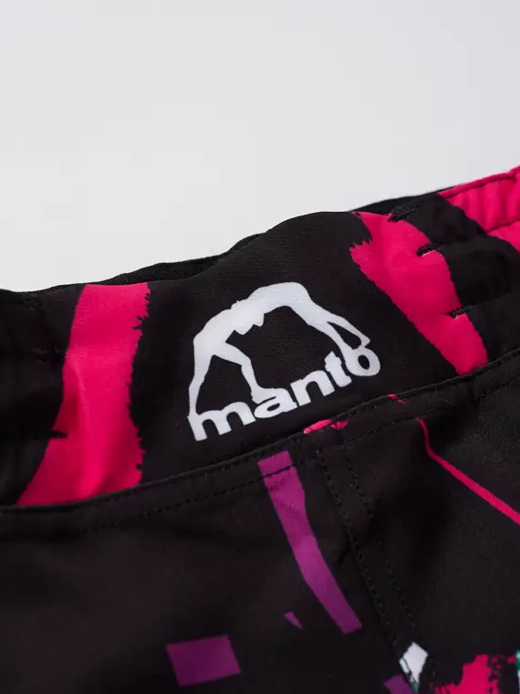 A pair of Manto Rave Shorts hanging on a white background.