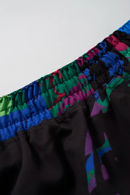 Manto Rave Fight Shorts on white background