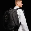 A Manto Society Convertible Backpack in laid open position