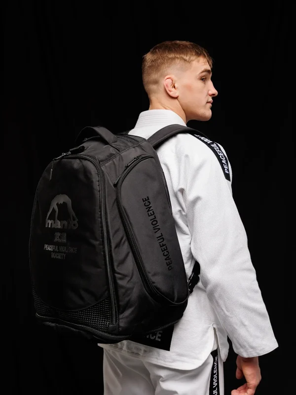 A Manto Society Convertible Backpack in laid open position