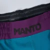Manto Society Fight Shorts on a white background