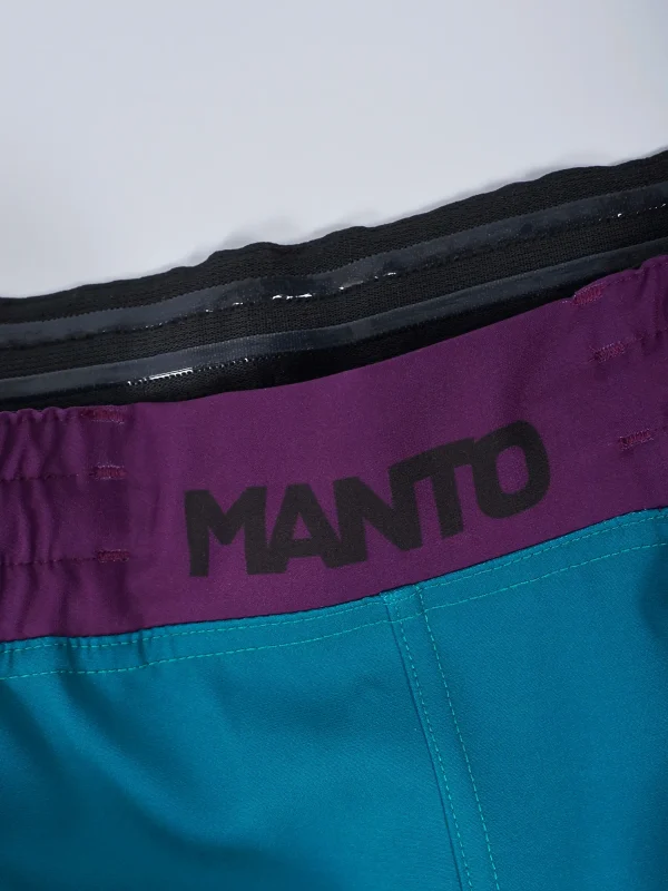 Manto Society Fight Shorts on a white background