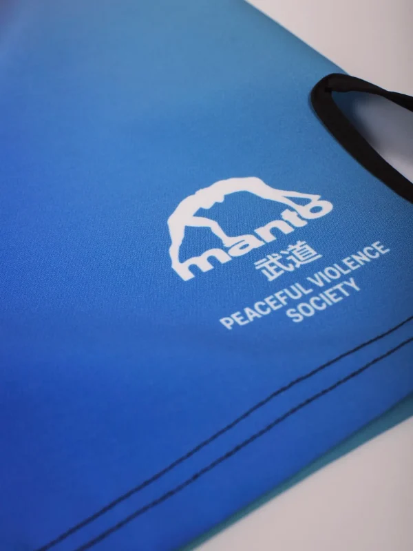 Manto Society Gradient Fight Shorts on a plain background