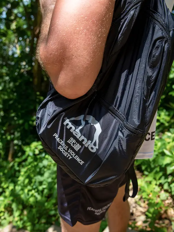 Manto Society Packable Lightweight Backpack Black 2 Stylish Manto Society Packable Lightweight Backpack in an urban setting