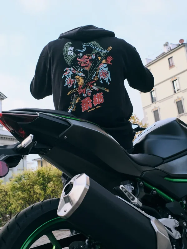 Man wearing a Manto x Yauhen Abu Tengu Hoodie in a casual setting.