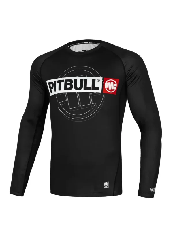 Pitbull Hilltop Sports Longsleeve Rash Guard. Man wearing a 'Pitbull Hilltop Sports Longsleeve Rash Guard' in a casual setting.