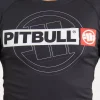 Pitbull Hilltop 2 Rash Guard Black Grey Camo 12 Man wearing the Pitbull Hilltop 2 Rash Guard, a high-quality sports attire perfect for training.